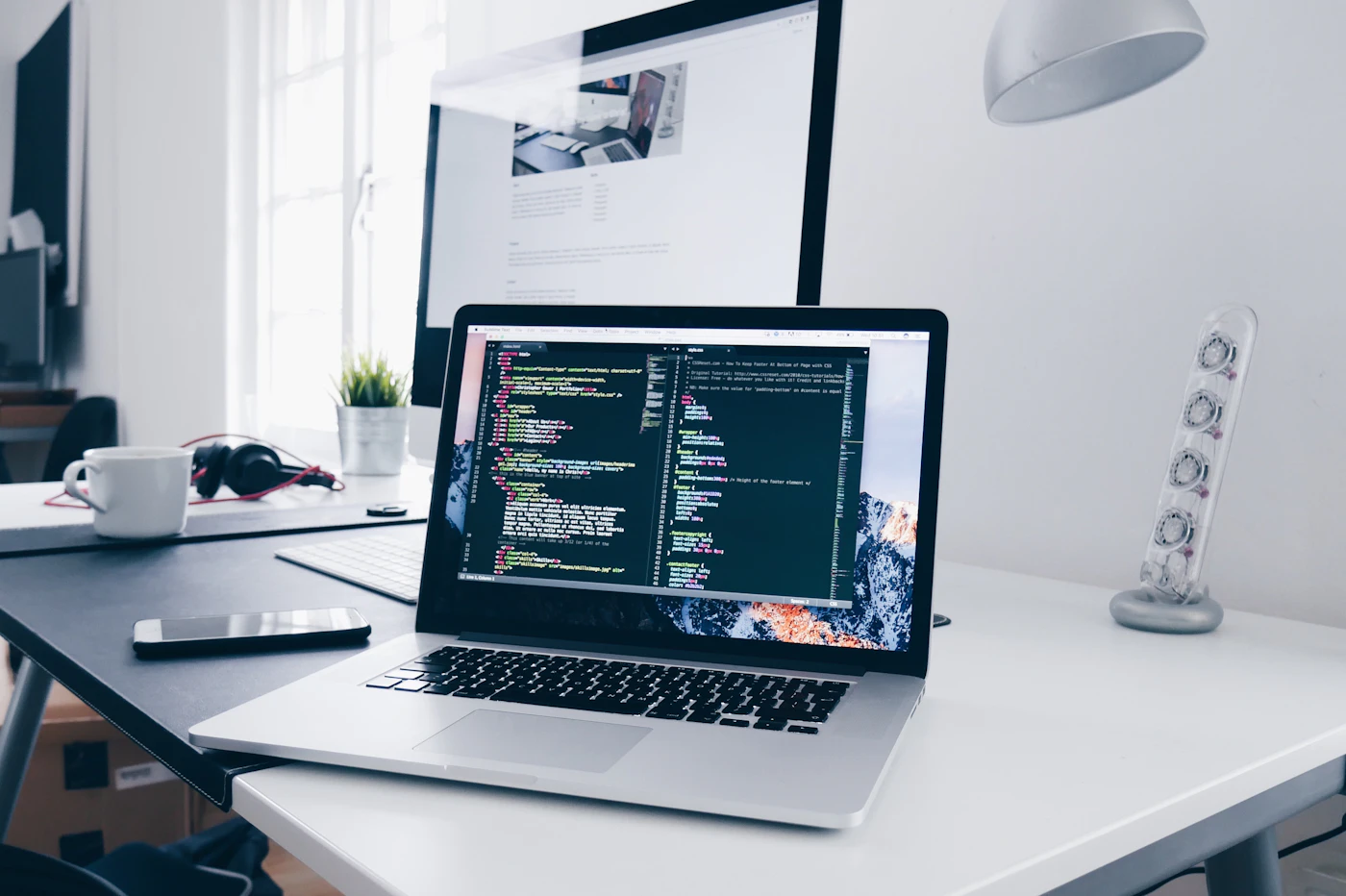 Developer using AI-assisted web development to build a custom website for a US and UK business